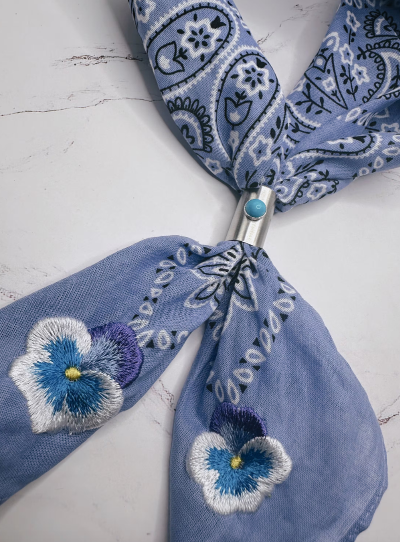 Purple bandana with embroidered pansies in corner