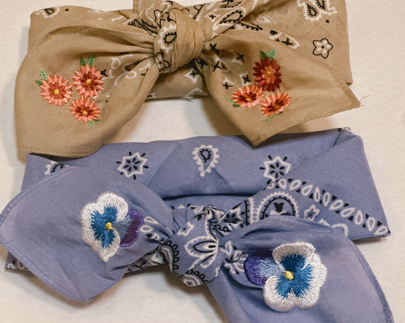 Purple bandana with embroidered pansies in corner